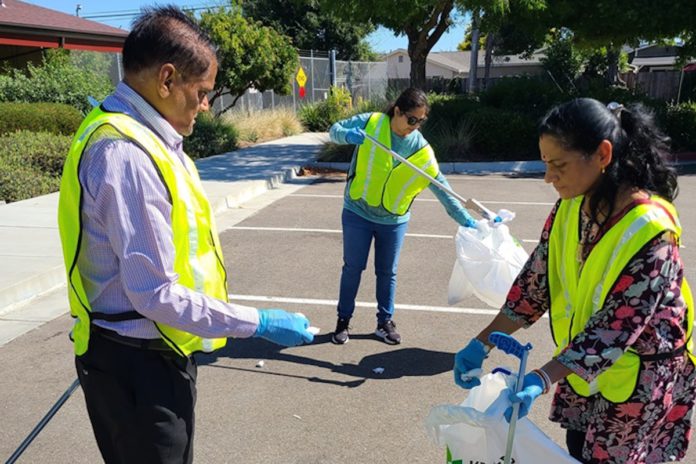 Global nonprofit volunteers participate in cleanliness drive