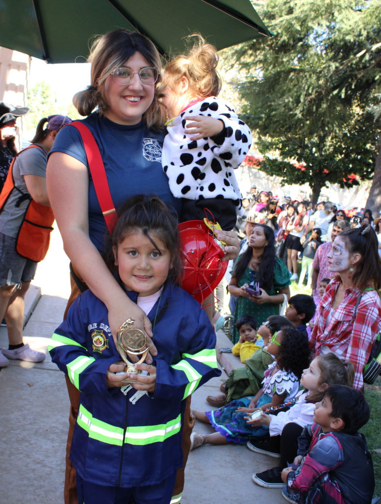 Valentina Orozco (firefighter), Catalina Orozco (dalmatian), Briana Orozco (firefighter), Best Group Costume Award. Photo courtesy of Candle Lighters