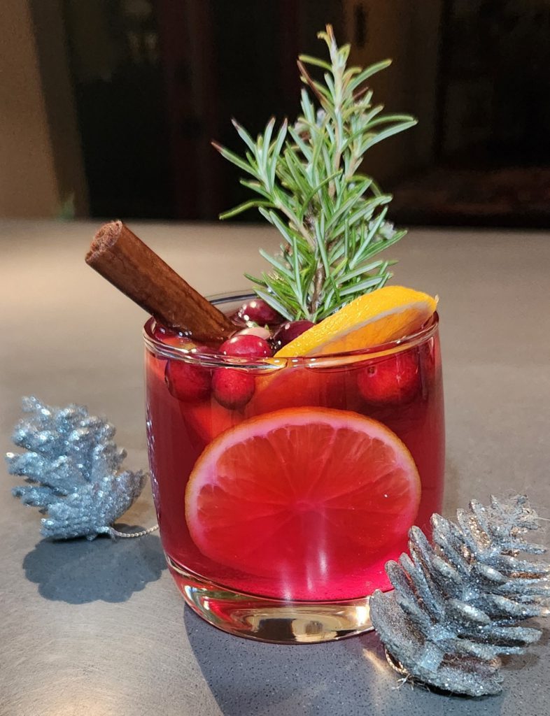 After serving mulled wine, garnish the glass with a lemon twist, cinnamon stick or rosemary sprig. Photo credit: Daniel O’Donnell