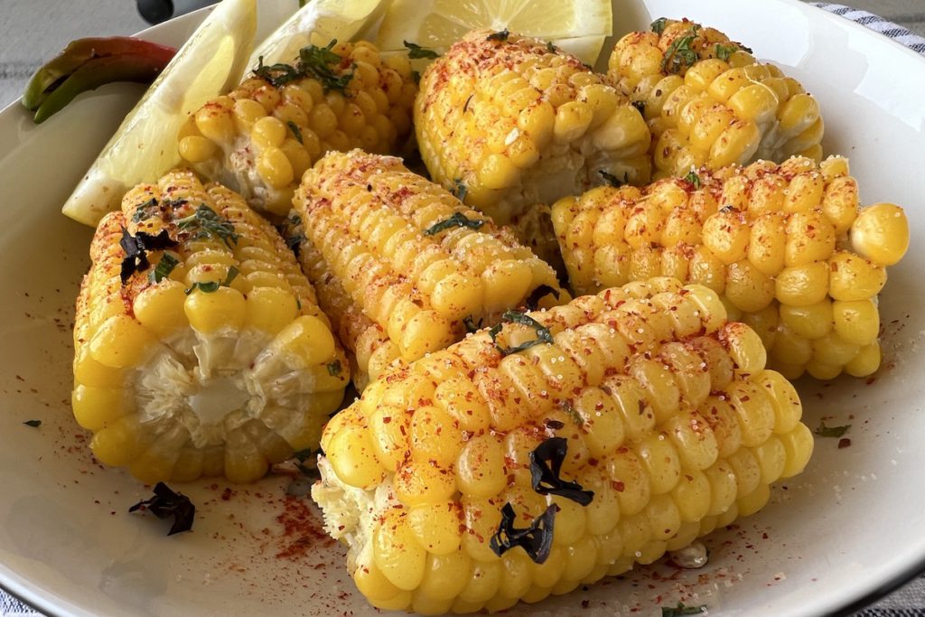 Grilled corn with butter and seasoning is a summer classic. Madhvika Singh