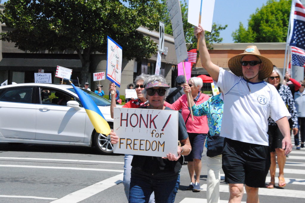 There was no moment of silence as protestors encouraged drivers to honk in agreement. April Ramos