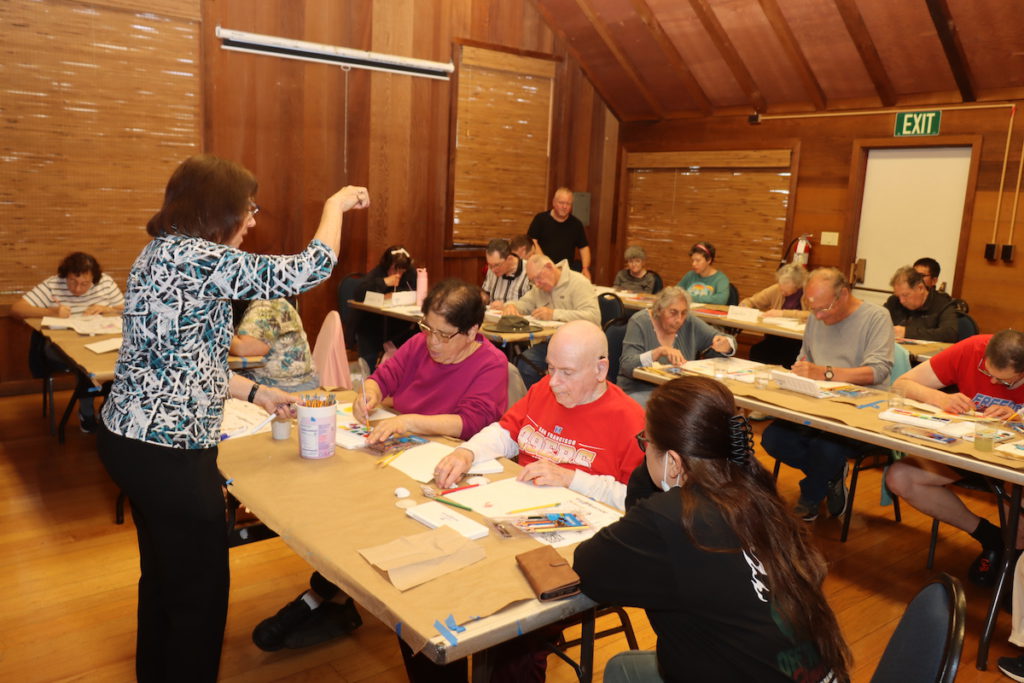 Instructor Edie Christensen enjoyed seeing the students work on their art and socialize together. Courtesy of Olive Hyde Art Guild