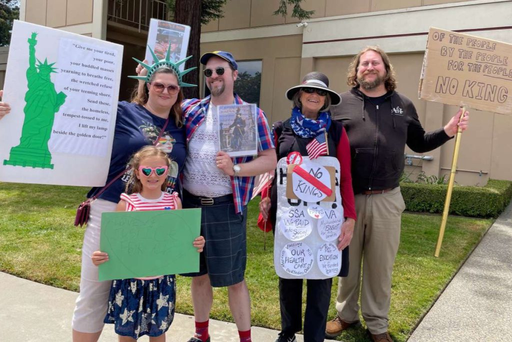 People came with their loved ones and held up signs on June 14 along Paseo Padre Parkway. Courtesy of Toni Shellen
