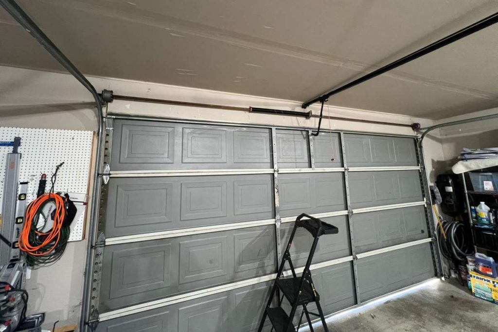 Check the tracks for dust, the alignment of sensors and the functionality of the pull cord. Courtesy of YBM Garage Doors