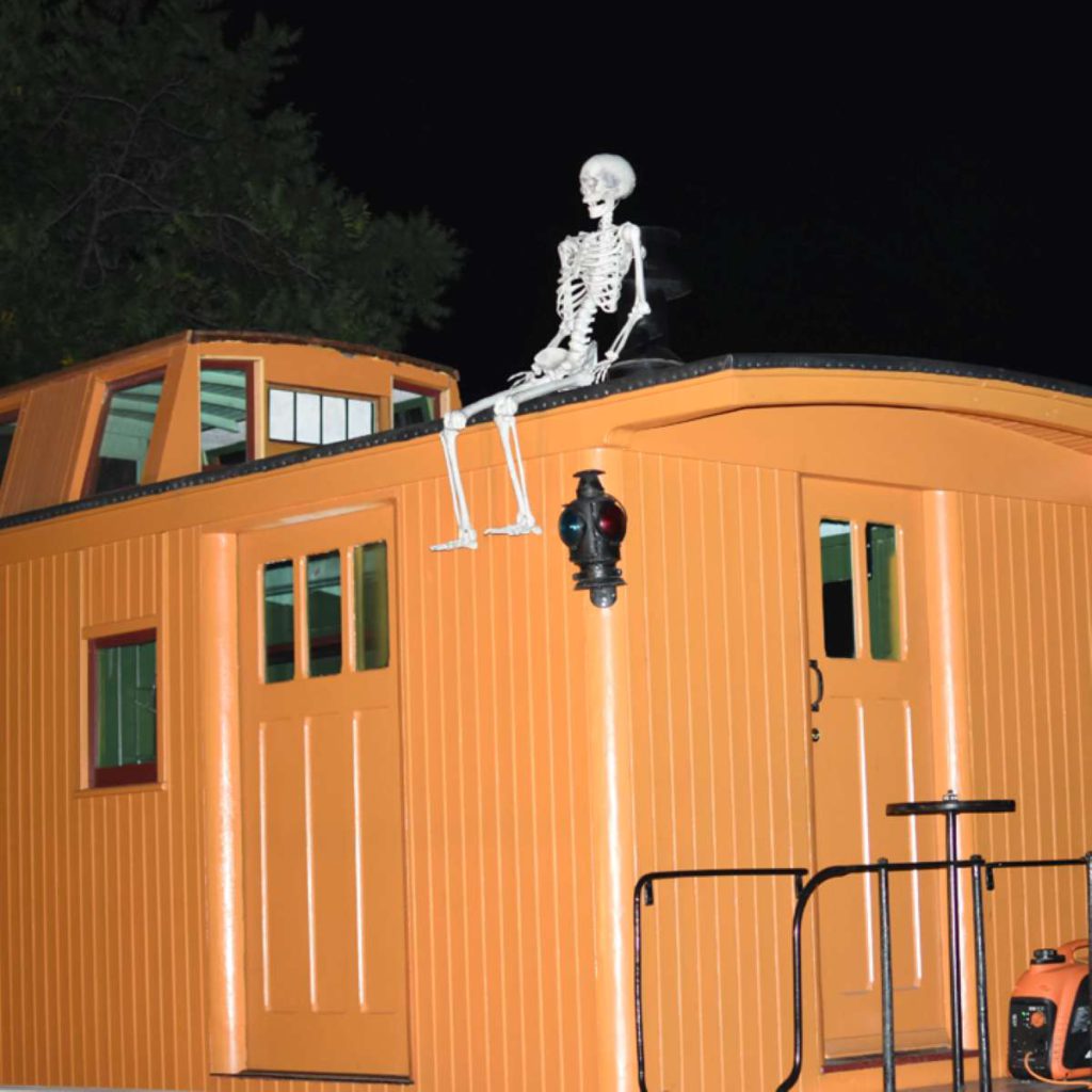 Skeletons have been known to catch rides on the Haunted Train’s caboose. Courtesy of Jacque Burgess