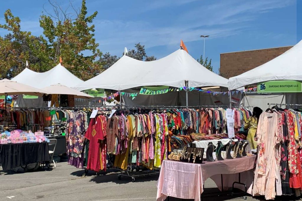 The event features a variety of vendors selling food, art, clothing, and jewelry.  Ava Acharya