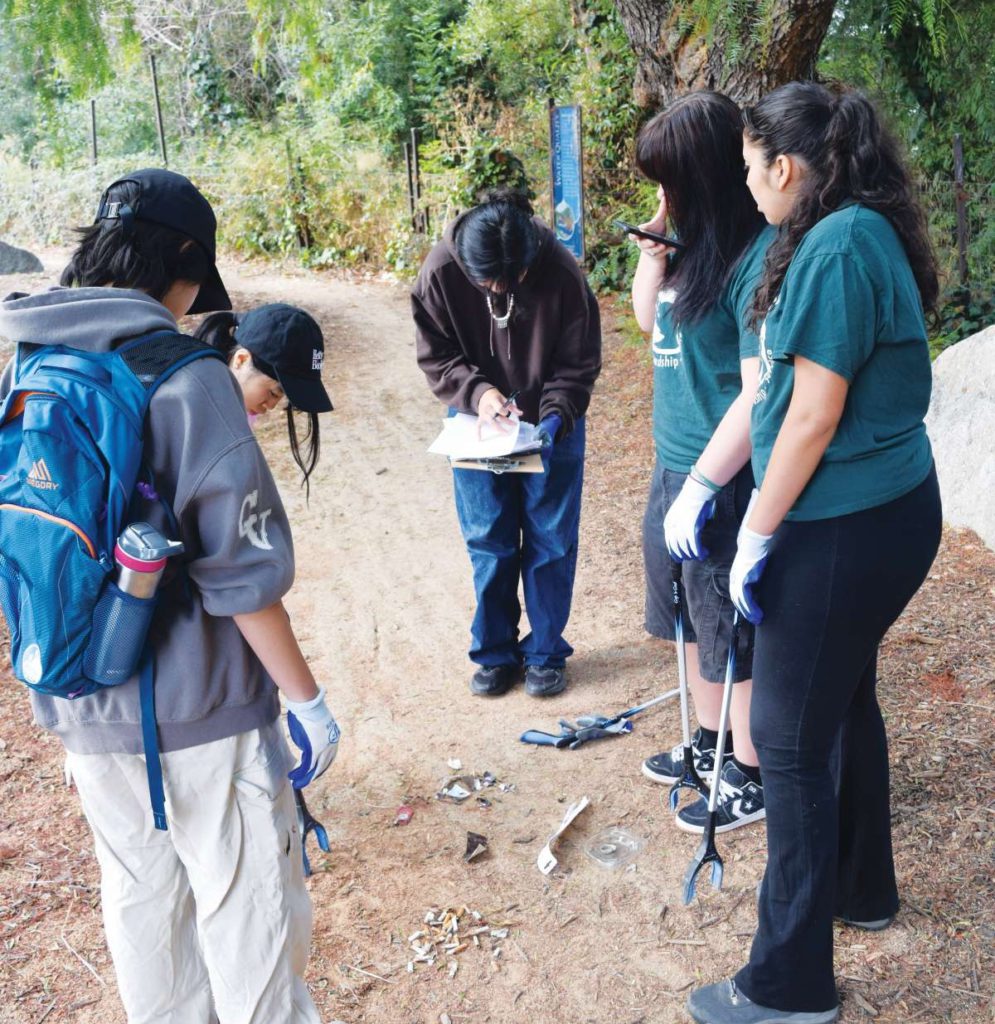 At cleanups, volunteers collect trash such as cigarette butts, food wrappers, and plastic caps and bags.