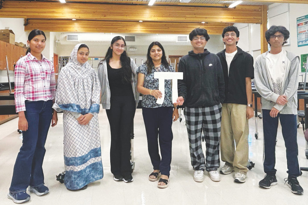 Left to Right: events director Shantilata Sahu, treasurer Bethool Batul Raja, secretary Sahana Kohli, club advisor Shikha Sharma, president Aksh Parekh, vice president Arjun Nirmal, and outreach director Smaran Sure. Courtesy of Promoting Innovative Individuals