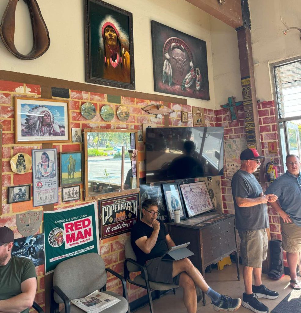Art pieces decorate the inside Rick Reboca’s Sundale Barber Shop. Roelle Balan