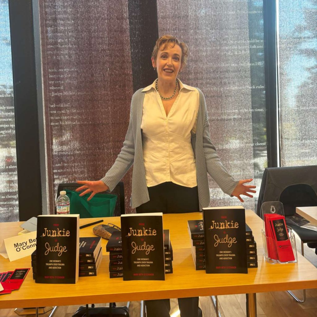Mary Beth O’Connor stands behind her book From Junkie to Judge—a memoir about her struggles with addiction and trauma.
Photos by Avni Mishra
