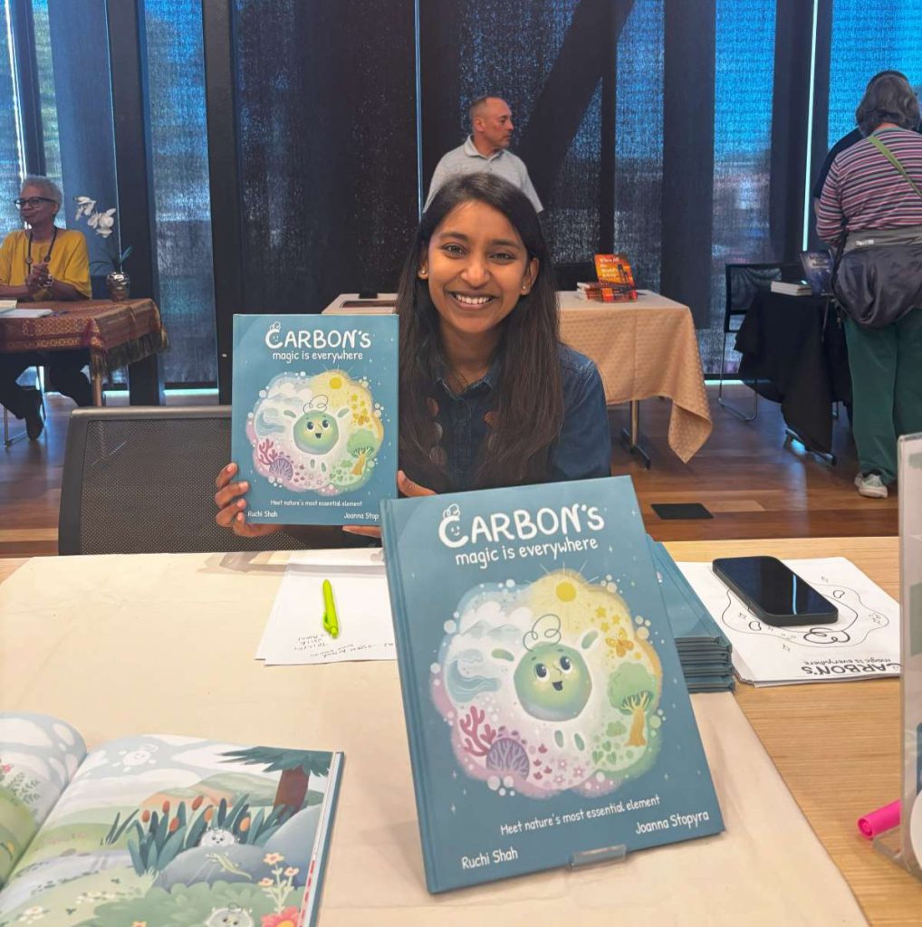 Ruchi Shah holds up her first children’s book, Carbon’s Magic is Everywhere.
Photos by Avni Mishra