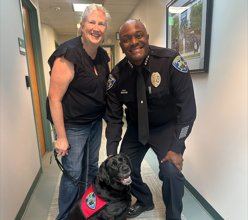 Therapy dog Maddox with his handler Kathleen Brown and Fremont Police Department Police Chief Sean Washington. Brown is also a licensed marriage and family therapist and a program coordinator with Fremont Youth and Family Services.
Photo courtesy of Fremont Police Department