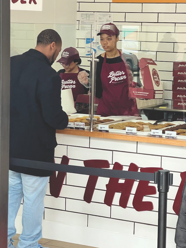 CHOOSE WISELY One of the first customers has a tough decision. David Newman