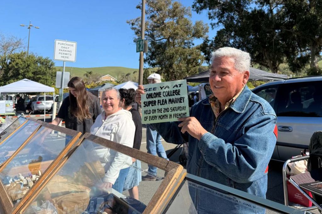 SIGN OF FAVOR This sign was made for antique jewelry vendor Bernie Lucero by the Flea Market’s founder Elaine Nagel. Photos by Paige Francis