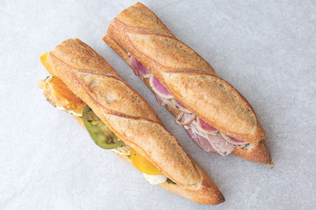 FLOUR POWER While the baking will be done at the original location cafe visitors will still be able to enjoy breads and sandwiches. 
Courtesy of As Kneaded Café