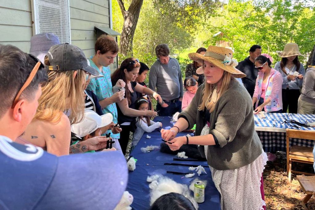 OUT ON A LAMB Ardenwood staff and volunteers guide visitors through making a Wooly Lambs craft, a longstanding Ardenwood tradition.
Courtesy of Luke Bailey