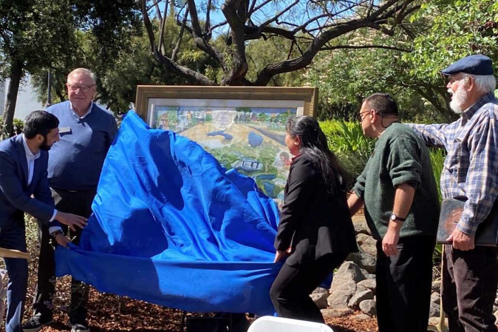 UNVEILING Board members remove a blue cloth to show off Nancy Pratt’s water district-inspired watercolor.
Stephanie Uchida
