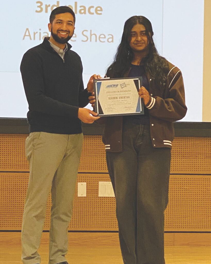 HIGH SCHOOL Rukmini Anantha receives her first place certificate from Director Akbari. Stephanie Uchida