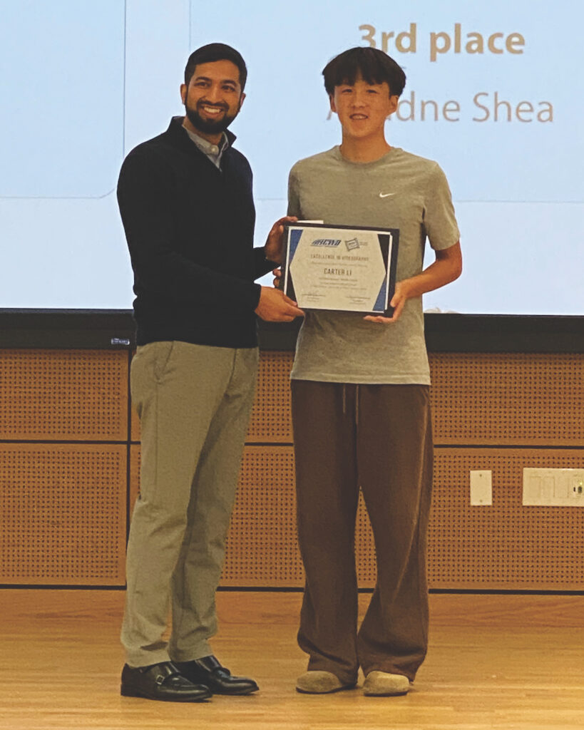 JUNIOR HIGH Carter Li receives his first place certificate from Aziz Akbari.
Stephanie Uchida