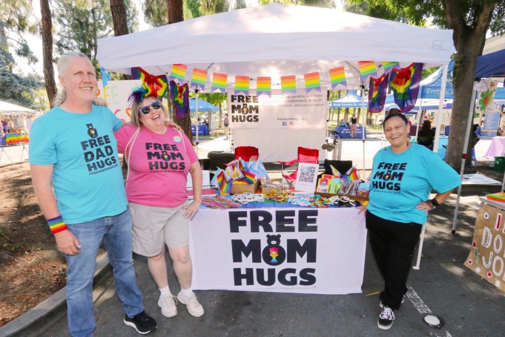 REACHING OUT Eric Albertson, Michelle Albertson and Marylou Parnala happily give hugs.
Photos by Victor Carvellas