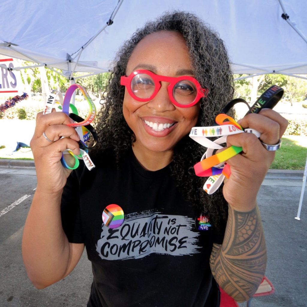 PRIDE MERCH East Bay Stonewall Democratic Club’s Chantel “CB” Carter shares rainbow favors. Photos by Victor Carvellas