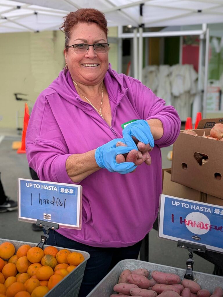 SOUL FOOD A happy volunteer is ready to serve.
Photos courtesy of TCV Foodbank