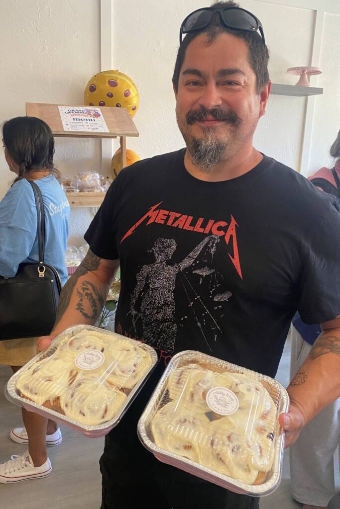 ROLL OUT A customer chooses a box of cinnamon rolls.
Stephanie Uchida
