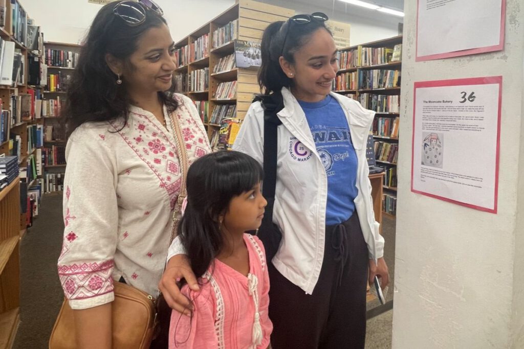 LIGHT READING Visitors on the day read the stories posted on pillars in Half Price Books and voted for their favorites.
Courtesy of Arathi Satish